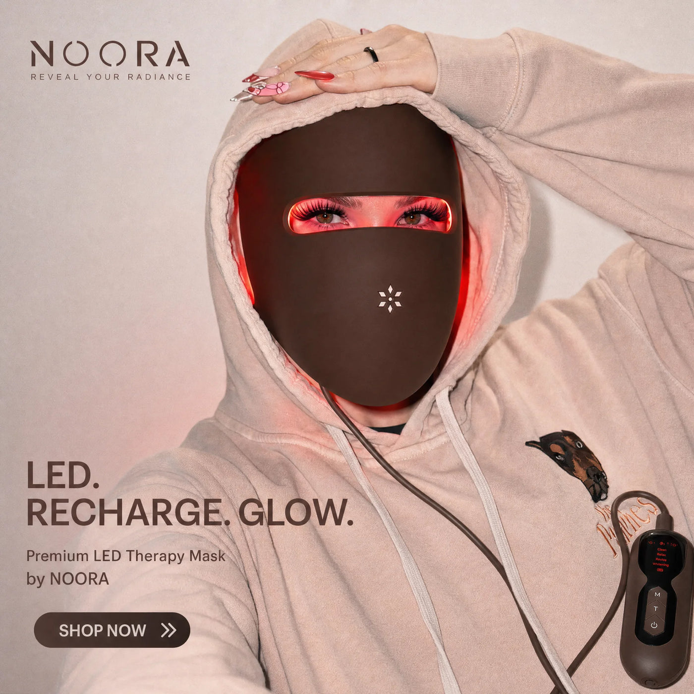 Woman in her 30s wearing the NOORA red light therapy face mask during her 20-minute cycle-synced wellness ritual